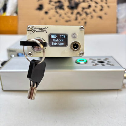 OLED control display on Glad Laser 120W handheld laser igniter showing battery and unlock status