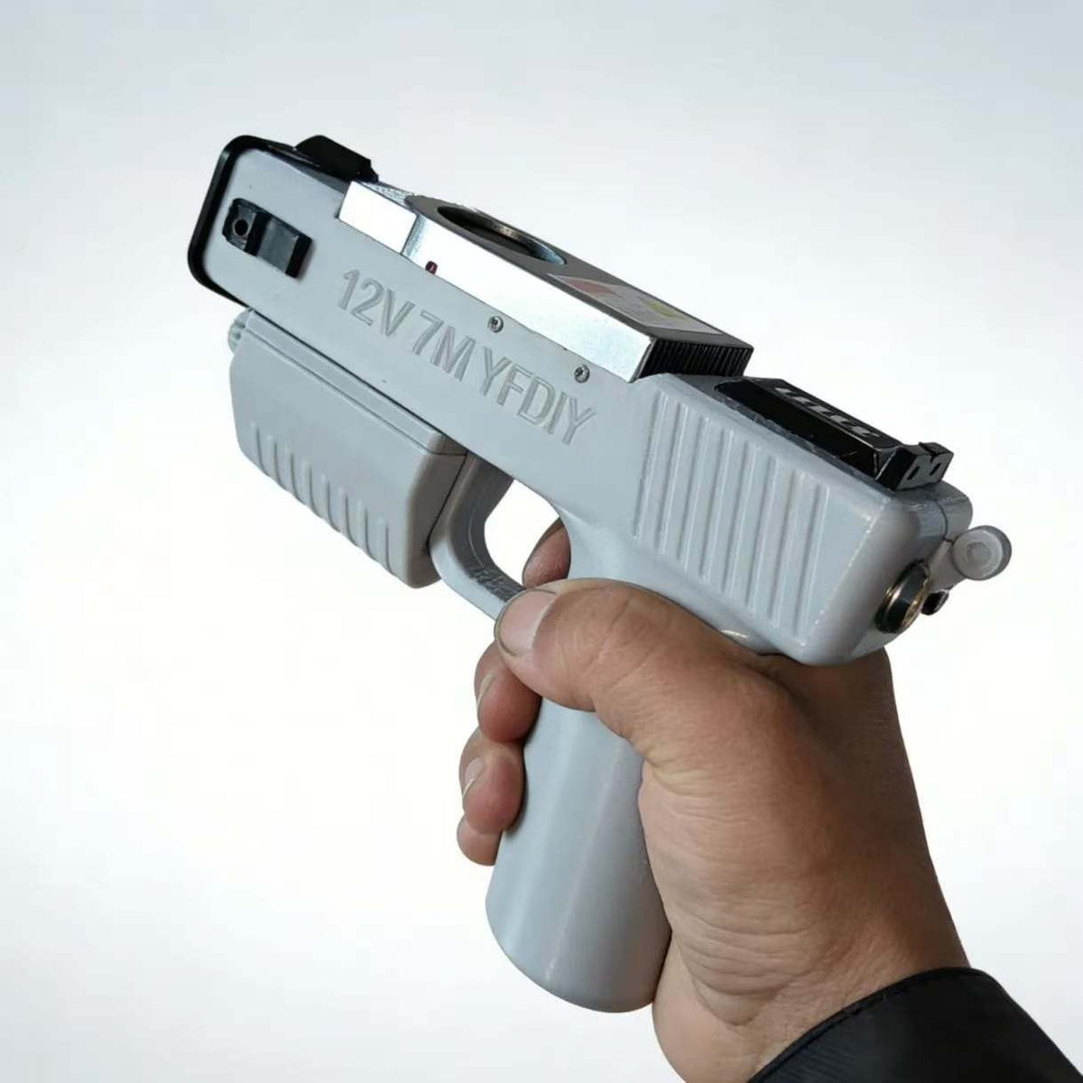 90W handheld portable laser igniter shown in a controlled product demonstration